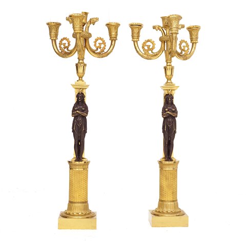 Pair of gilt Empire candelabra. France around 
1820. H: 57cm