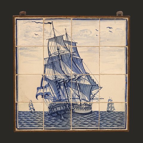 A large 19th century tile picture with a blue 
decorated ship. The Netherlands circa 1880. Size: 
54,5x54,5cm