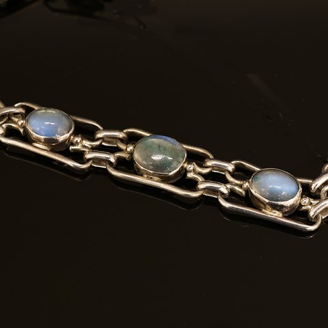 Silver bracelet with moonstones. Signed A.H.W. L: 
19cm