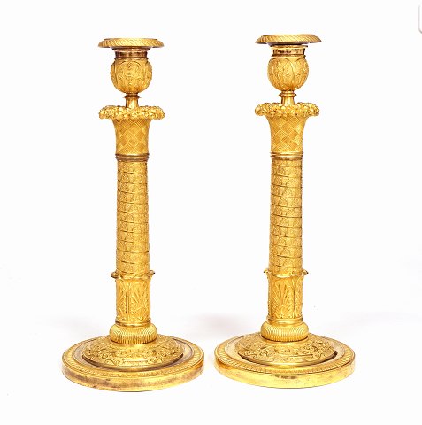 A pair of Louis XVI gilt candle sticks. Paris 
circa 1800. H: 33cm