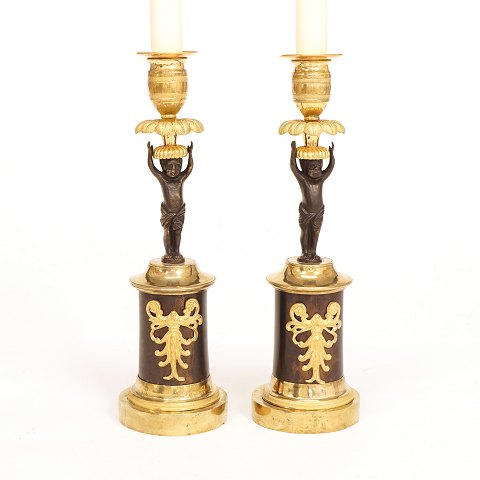 A pair of gilt bronze candle sticks. France circa 
1820. H: 24cm