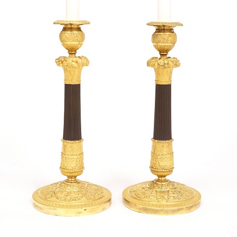 A pair of gilt Bronze candelsticks. France circa 
1810-20. H: 33cm