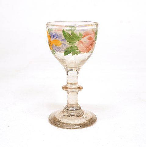 A small enamel decorated glass. Circa 1860. H: 9cm
