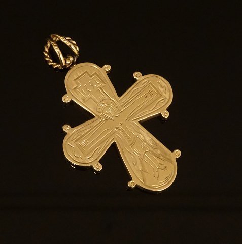 Hänger in Form von einem Kreuz in 14kt Gold. 
Masse: 3,7x3,1cm