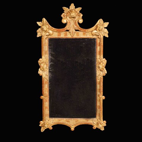 A gilt 18th century Rococo mirror. Denmark circa 
1760. Size: 90x49cm