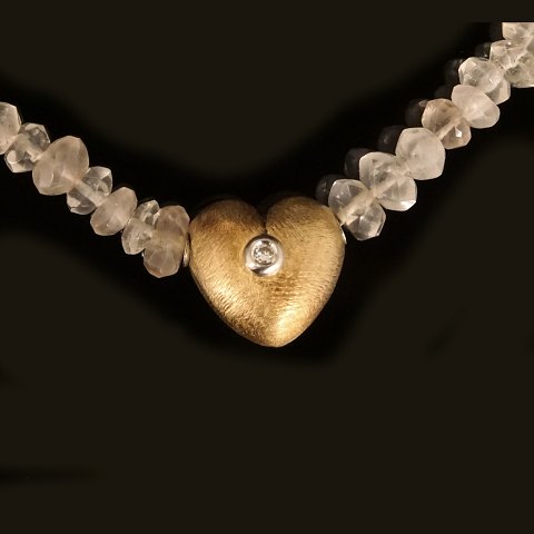 A 14kt gold Ole Lynggaard, Copenhagen, heart 
clasp. Size: 13x11mm