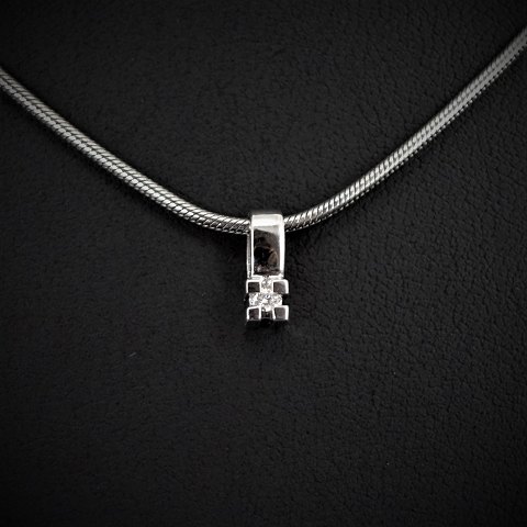 Aagaard; A diamond pendant of 14k white gold, necklace of silver