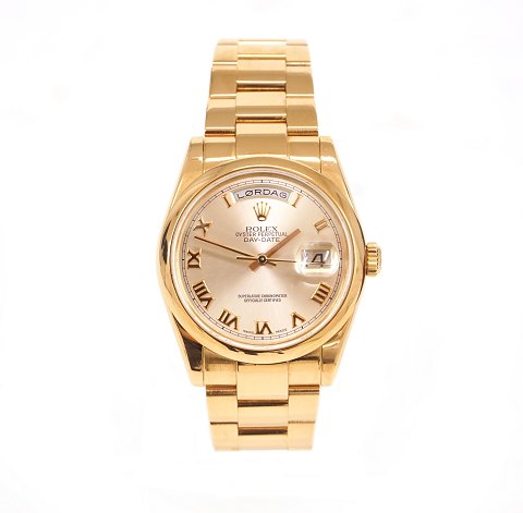 Rolex President 18kt rose gold Oyster Perpetual 
Day-Date. P-series year 2003. Reference: 118205. 
D: 36mm