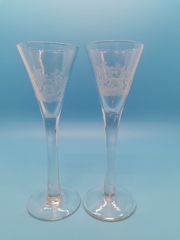 A pair of tall shot glasses with deer Kastrup 
Glasværk