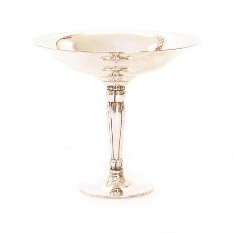 A sterlingsilver tazza made by Holmsted, Denmark. 
H: 25cm. W: 1.503gr
