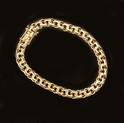 14kt gold bracelet by Bremer Jensen, Randers, 
Denmark. L: 19,5cm. W: 7mm. W: 20gr