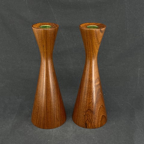 A pair of modern teak candleholders