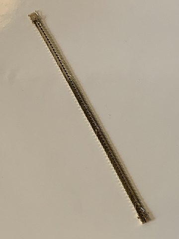 Geneva Bracelet in 14 carat Gold
Stamped 585 HCH
Thickness 2.13 mm approx
Length 19.5 cm cm
Width 6.69 mm
