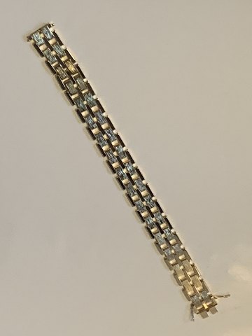 Block Bracelet 5 Rk in 14 carat gold
with splicing
Stamped 585
Length 21.2 cm approx
Width 15.36 mm