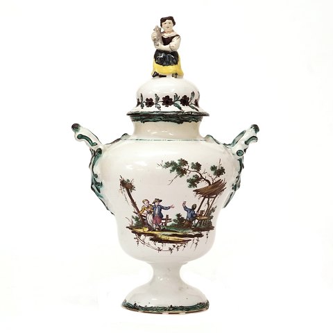 Polychrome lidded Rococo faience vase by the 
manufacture of Stockelsdorf, Northgermany. Signed 
Stff / B / AL, Stockelsdorff, director Buchwald 
and painter Abraham Leihammer 1772-74. H: 38cm