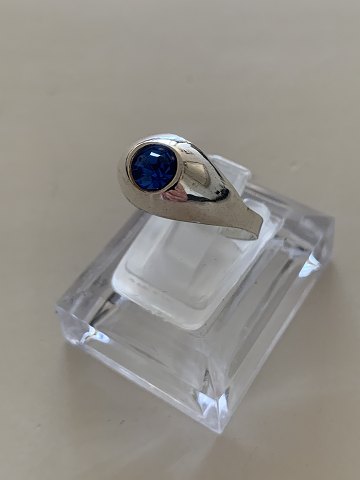 Open silver ring Sterling
Stamped 925 S
with blue stones
The ring can be adjusted from size 56 to 58