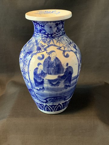 Chinese vase with blue painting in classic style.