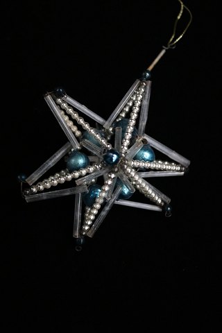 Old Christmas tree decoration in the shape of Christmas
star made of small glass balls and tubes from around 1940...