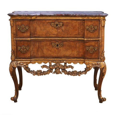 Walnut veneered and partly gilt marble top commode 
made by the manufacture Köster, Altona, 
Northgermany, circa 1770. H: 78cm. Top: 85x43cm