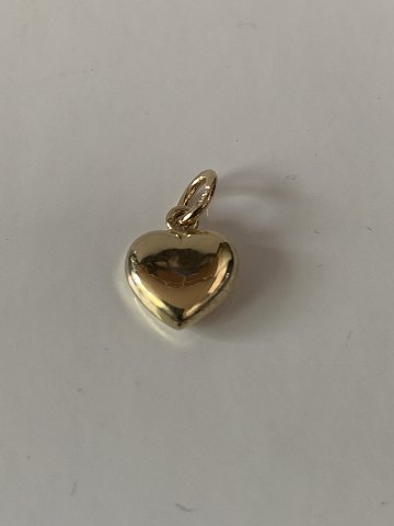 Beautiful and elegant gold heart in 14 carat gold. Stamped 585. Pendant for 
necklace or bracelet.