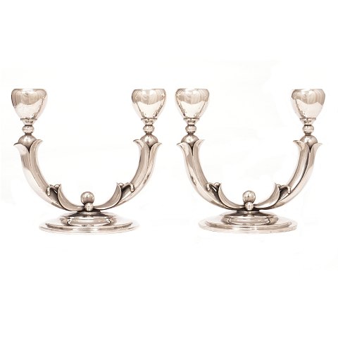 Pair of Danish silver candelabra by P. Hertz, 
Copenhagen, 1936. H: 15cm. W: 16,5cm (each)