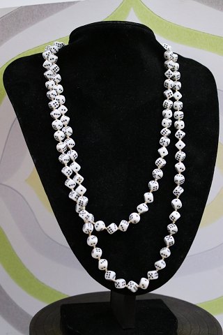 Nice, old necklace made of 110 small glass cubes. 
Length 120 cm.