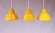 Set of 3 yellow workhop pendants of danish design from the 1960s.
5000m2 showroom.