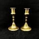 A set of brass candleholders

