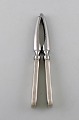 Rare Georg Jensen Old Danish nut cracker in sterling silver and stainless steel.
