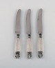 Three Georg Jensen Acanthus fruit knives in sterling silver and stainless steel.
