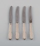Fire Evald Nielsen nummer 14 små frokostknive i hammerslået sølv (830) og 
rustfrit stål. 1920