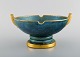 Josef Ekberg for Gustavsberg. Art deco bowl in glazed ceramics. Beautiful 
blue-green glaze and gold decoration. 1930s.
