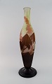 L'Art 
præsenterer: 
Kolossal 
antik Emile 
Gallé "Ricin" 
vase i matteret 
kunstglas med 
lysebrunt og 
sart pink ...