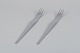 L'Art presents: 
Arne 
Jacobsen for 
Georg Jensen. 
Modernist AJ 
flatware.
Two long salad 
forks in 
stainless 
steel.