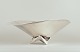 Henning Koppel for Georg Jensen, colossal bowl in sterling silver on a 
three-legged base.