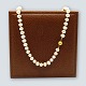 A pearl chain with 14k gold clasp, l. 62 cm. A pearl chain with 14k gold clasp, l. 62 cm.