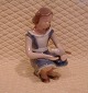 Antikkram 
presents: 
B&G 
figurine No 
2340 from 
Denmark, Girl 
feeding dove