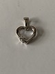 Heart-shaped pendant in 8 carat white gold with inlaid brilliant.
