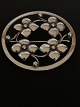 Beautiful brooch in silver with a nice pattern of flowers. Stamped HJ 830s