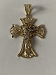 Gold cross in 14 carat red and white gold, and with beautiful details.