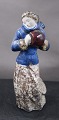 Michael Andersen Danish ceramics, Bornholm, in the series seasons. Young girl with blue jacket and muff, or winter