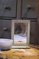 K&Co. presents: 
Swedish 
19th century, 
small mirror 
with small 
shelf 
underneath 
(barber mirror) 
in wood with 
...