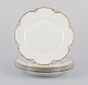 Et sæt på fire 
Haviland 
middagstallerkener 
af porcelæn.