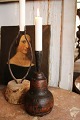 Antique Swedish candlestick from the year 1801, with a wooden base and wrought 
iron candle holder...