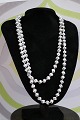 Nice, old necklace made of 110 small glass cubes. 
Length 120 cm.