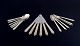 L'Art 
præsenterer: 
Georg 
Jensen 
Pyramide.
Komplet 
sekspersoners 
middagsservice 
i sterlingsølv.