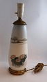 Lundin Antique 
præsenterer: 
Royal 
Copenhagen. 
Lampe med 
bronze 
montering. 
Model 1274 / 
184. Højde 40 
cm. (1 ...