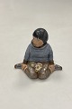 Danam Antik præsenterer: Royal Copenhagen Figur i Overglasur - Dreng med blomster fra Grønland No. 12419