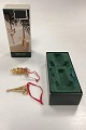 Danam Antik præsenterer: Georg Jensen Christmas Classics Fyrrekogle og Kræmmerhus 2005