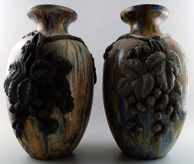 Roger GUERIN (1896-1954) A pair of large French Art Deco ceramic floor vases 
with blackberry stalks in relief.